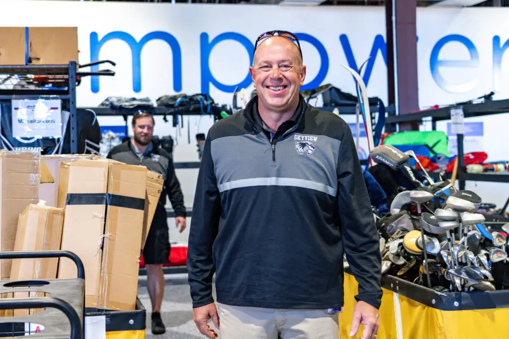 A smiling partner in the Donation Center.