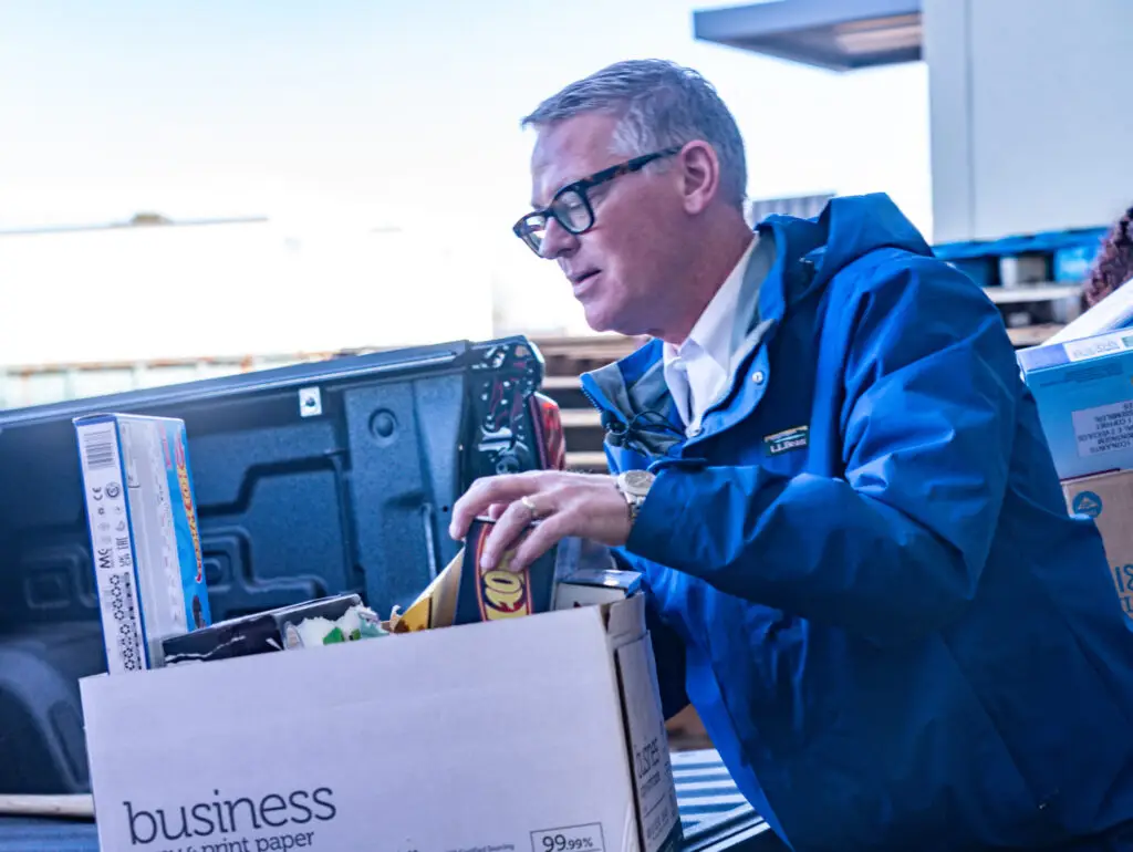 A drive host organizing Precious Gift donations.