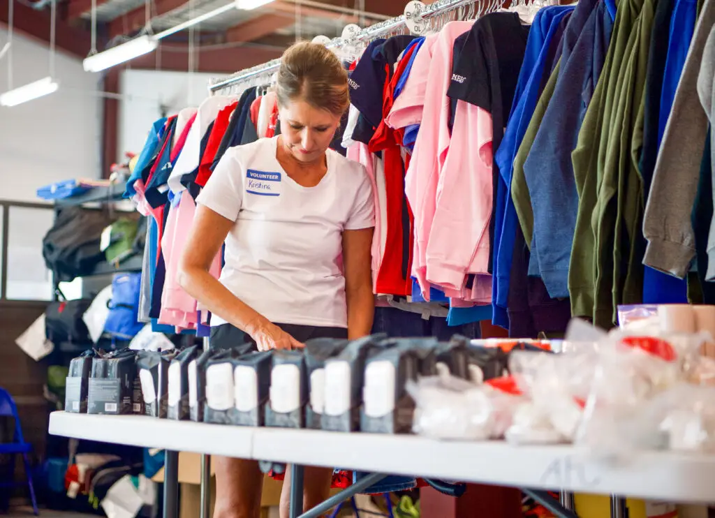 A volunteer sorts items in the Resource Center
